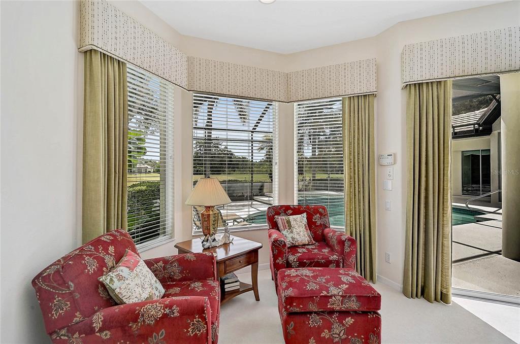 2111 Muskogee Trail Nokomis, FL 34275 - Photo 14 of 58 a living room with furniture and a large window