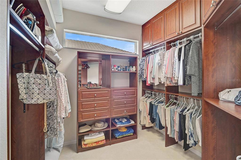 2111 Muskogee Trail Nokomis, FL 34275 - Photo 15 of 58 a view of walk in closet with clothes and shoes