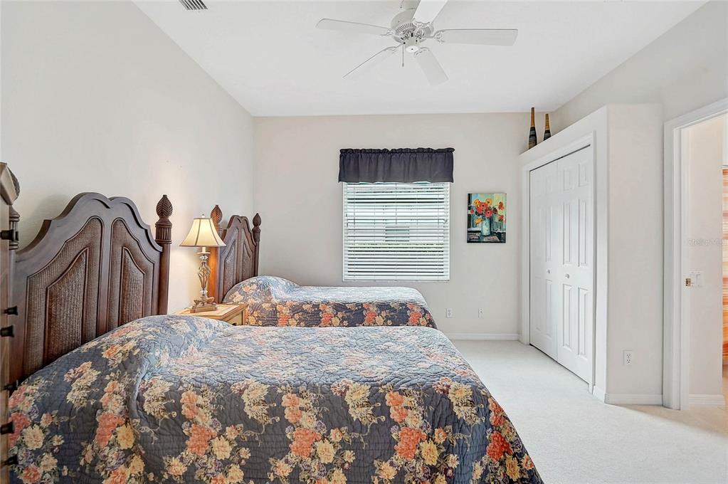 2111 Muskogee Trail Nokomis, FL 34275 - Photo 19 of 58 a bedroom with a bed and a window