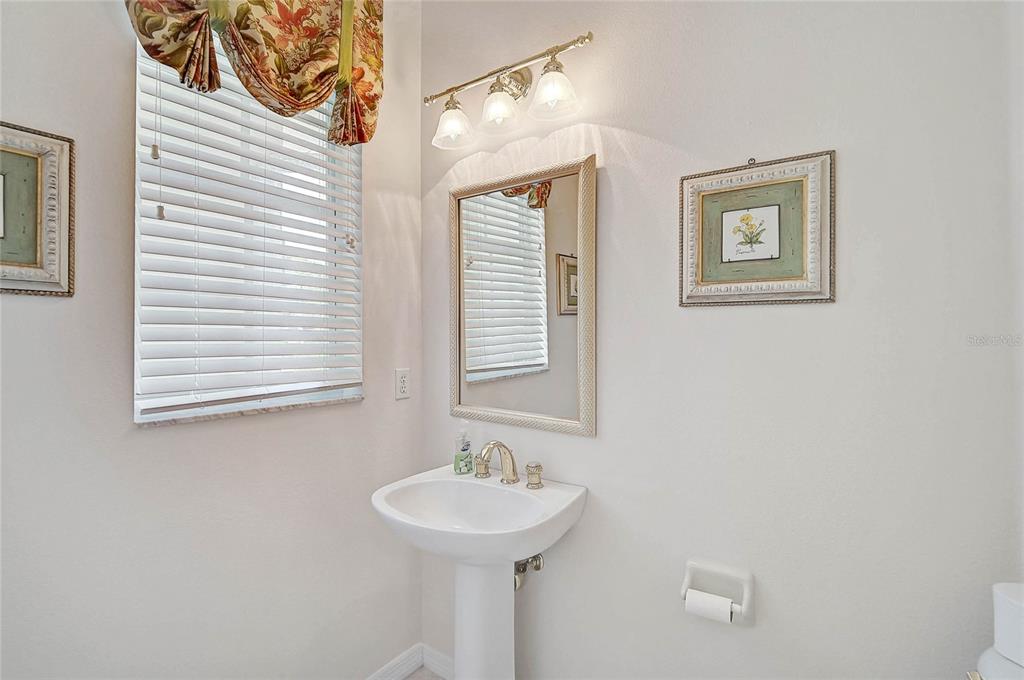 2111 Muskogee Trail Nokomis, FL 34275 - Photo 22 of 58 a bathroom with a sink and a mirror