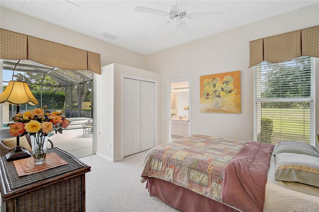 2111 Muskogee Trail Nokomis, FL 34275 - Photo 34 of 58 a bedroom with a bed and a couch