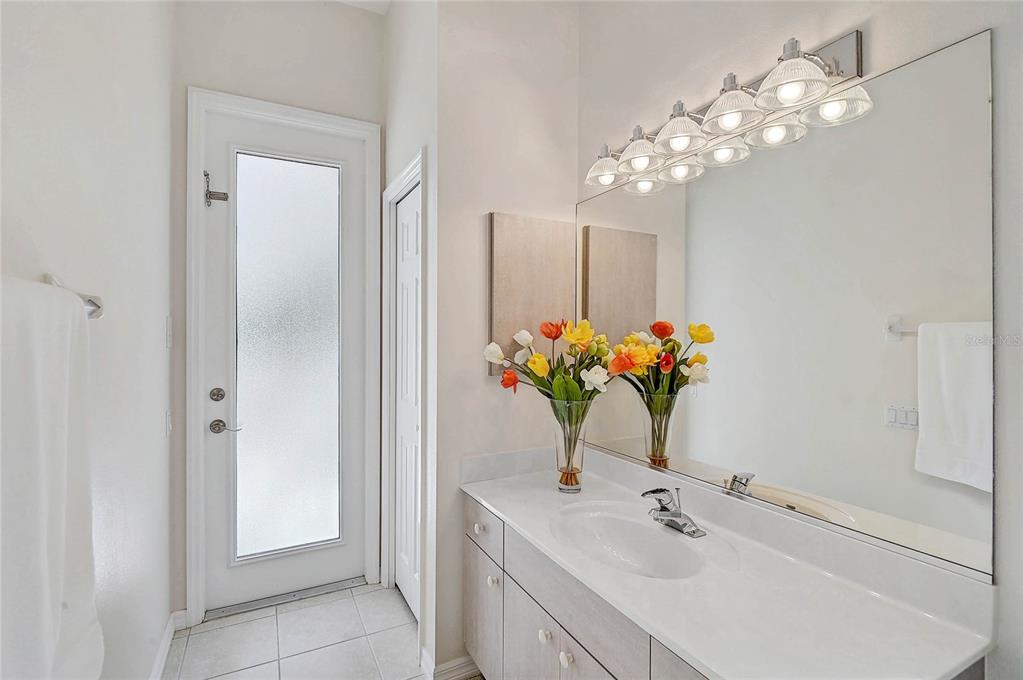 2111 Muskogee Trail Nokomis, FL 34275 - Photo 35 of 58 a bathroom with a sink vanity and a mirror