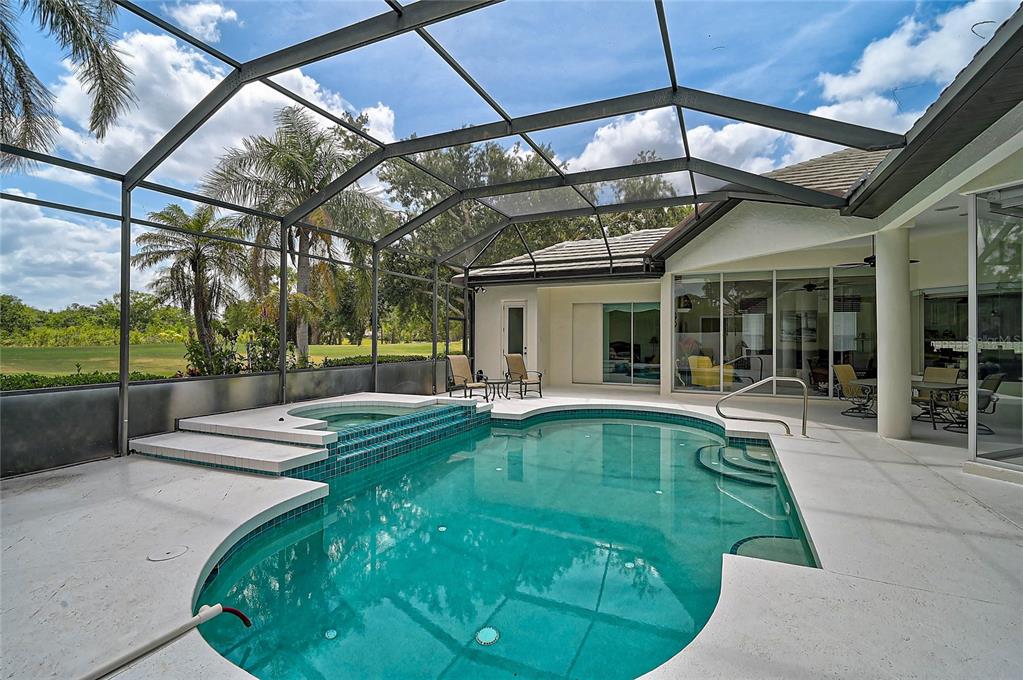 2111 Muskogee Trail Nokomis, FL 34275 - Photo 39 of 58 a view of a house with backyard porch and sitting area