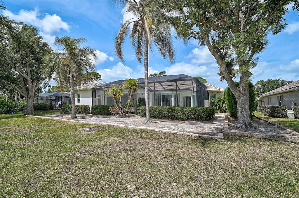 2111 Muskogee Trail Nokomis, FL 34275 - Photo 43 of 58 a view of a house with a yard