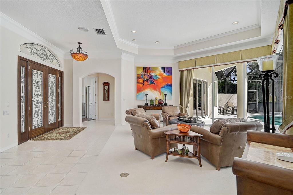 2111 Muskogee Trail Nokomis, FL 34275 - Photo 5 of 58 a living room with furniture and a window
