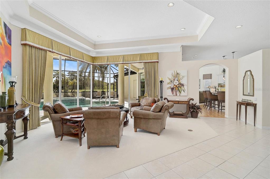 2111 Muskogee Trail Nokomis, FL 34275 - Photo 8 of 58 a living room with furniture and a large window