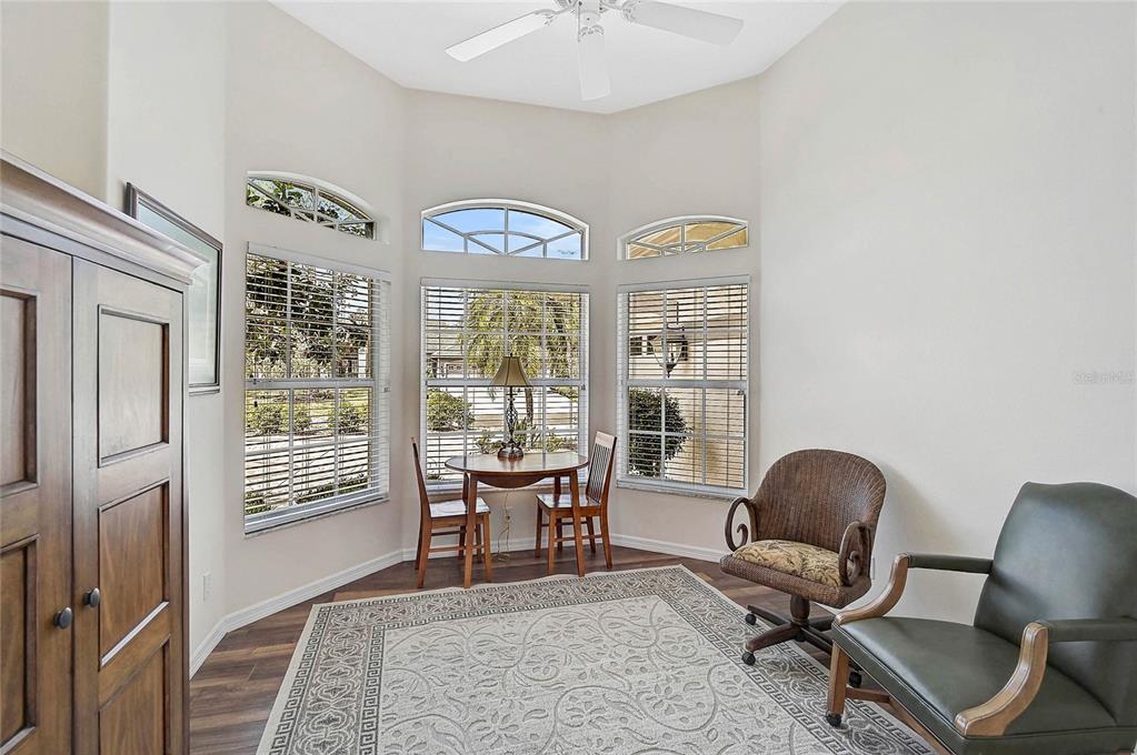 2111 Muskogee Trail Nokomis, FL 34275 - Photo 10 of 58 a living room with furniture and a window
