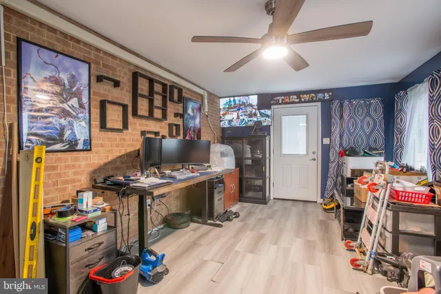 a view of a workspace with furniture and toys