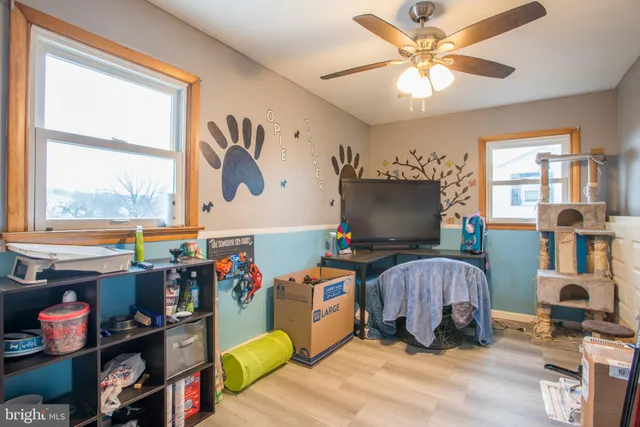 a living room with lots of furniture and a flat screen tv