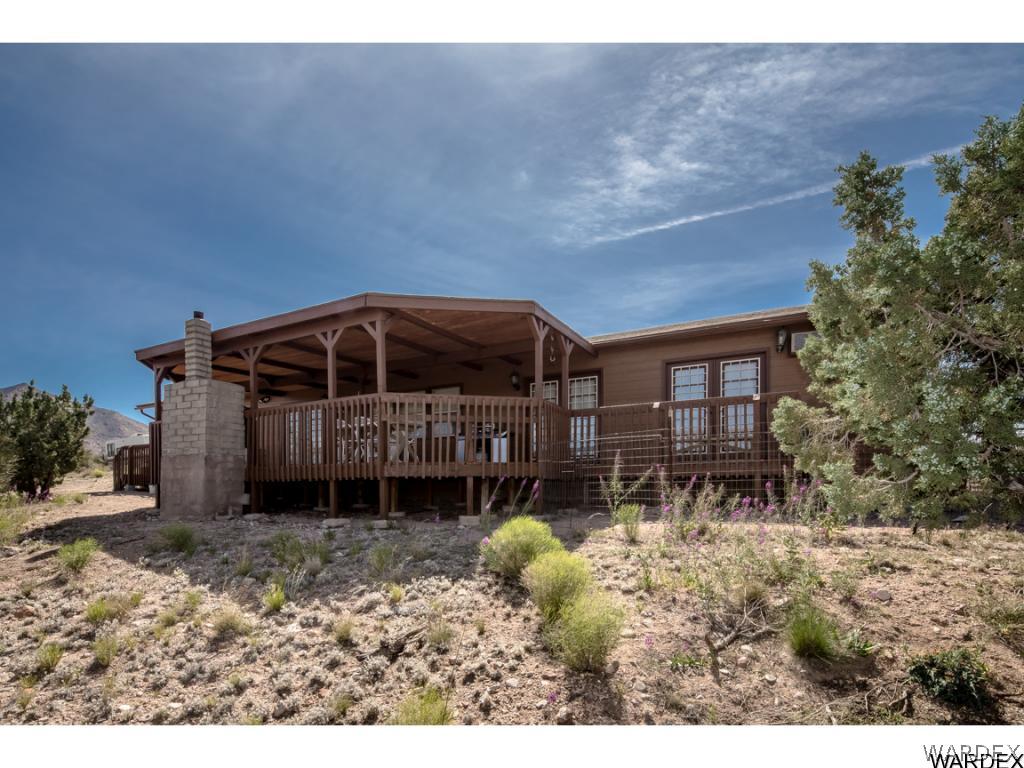 14760 Powerline Road Kingman, AZ 86401 - Photo 1 of 36 a backyard of a house with yard and trampoline