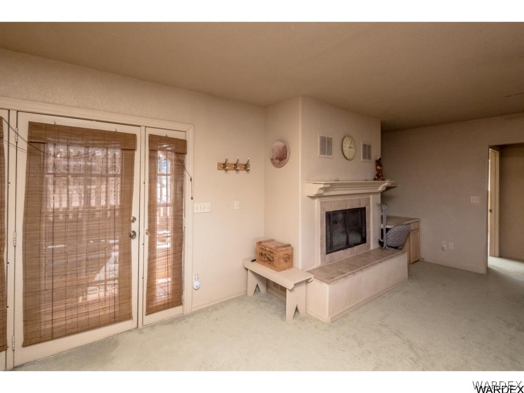 14760 Powerline Road Kingman, AZ 86401 - Photo 16 of 36 a living room with furniture and a fireplace