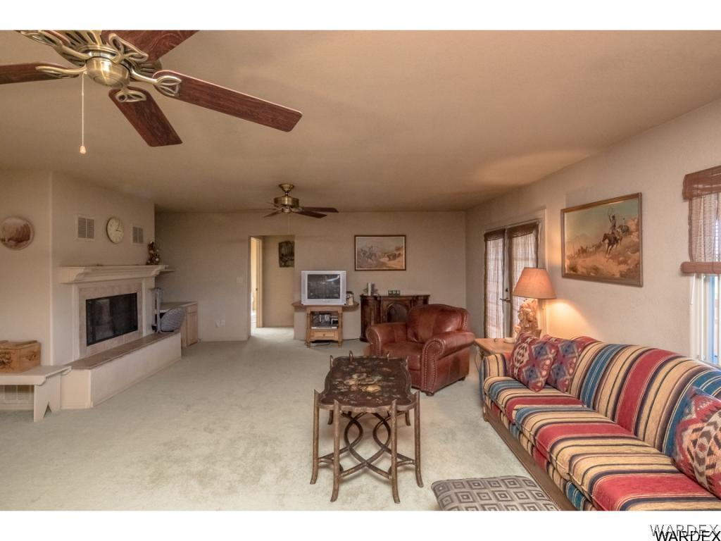 14760 Powerline Road Kingman, AZ 86401 - Photo 18 of 36 a living room with furniture and a fireplace
