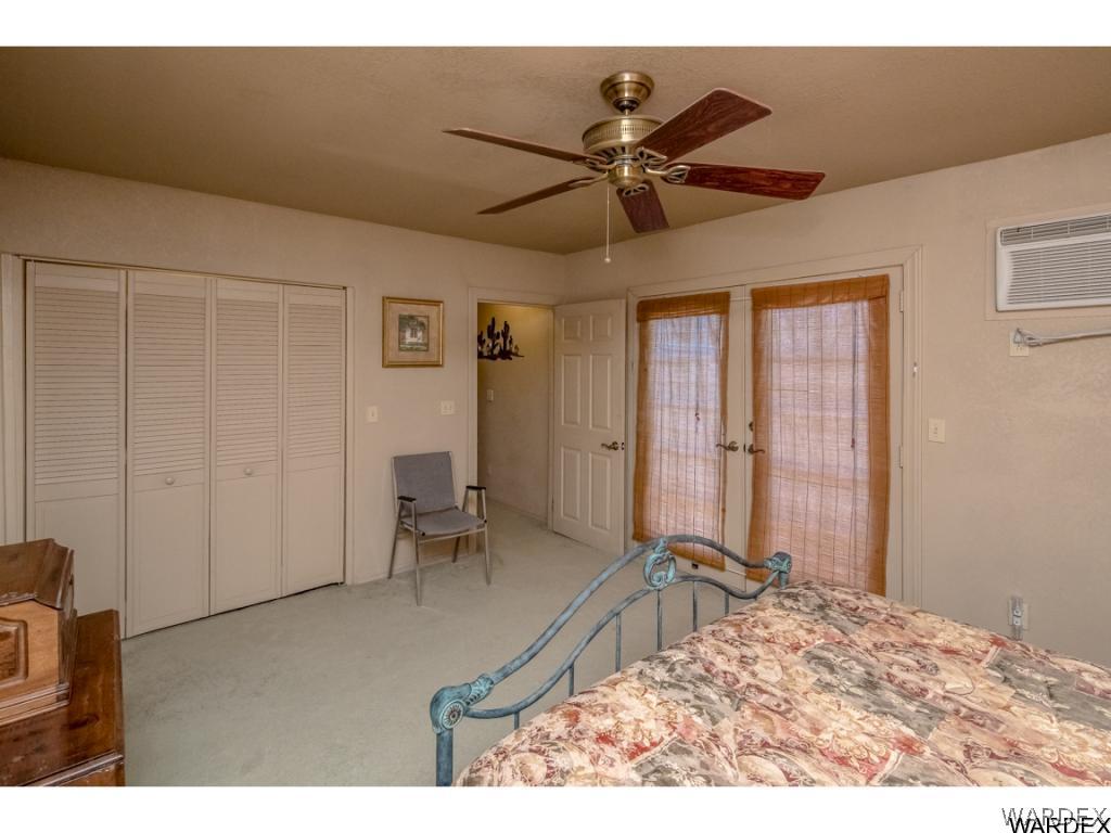 14760 Powerline Road Kingman, AZ 86401 - Photo 25 of 36 a view of a livingroom with a furniture window and wooden floor