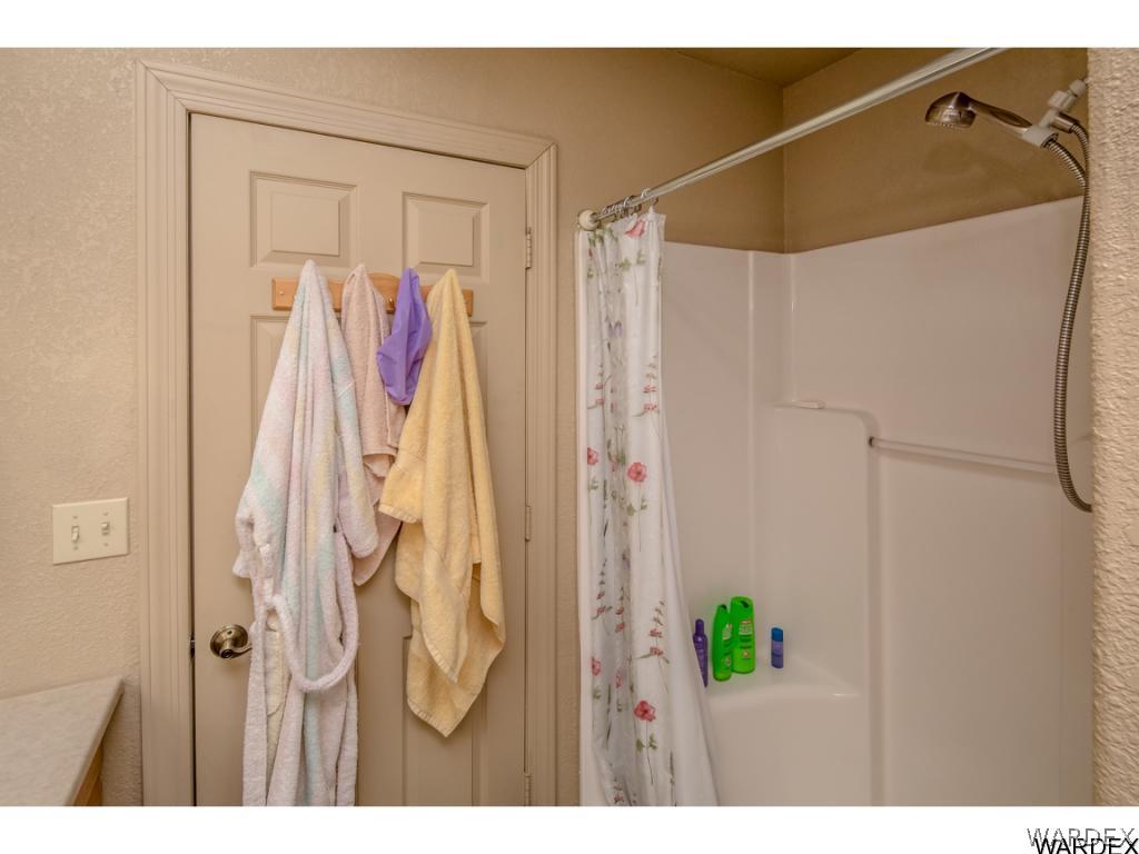 14760 Powerline Road Kingman, AZ 86401 - Photo 26 of 36 a view of walk in closet with clothes