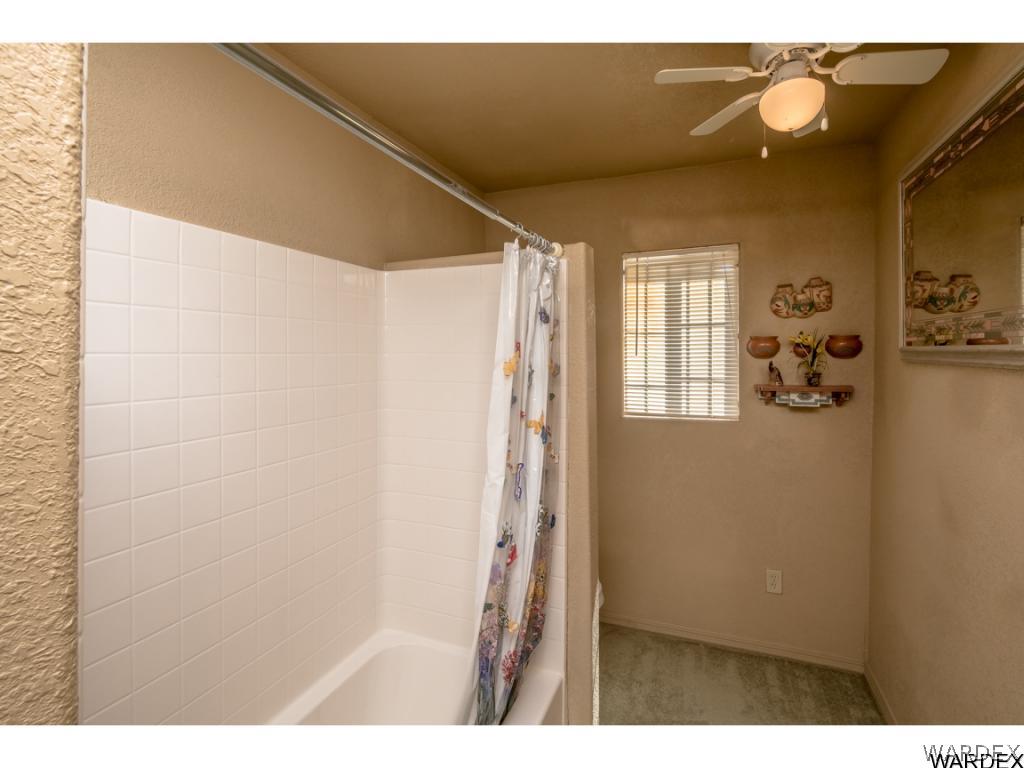 14760 Powerline Road Kingman, AZ 86401 - Photo 29 of 36 a bathroom with a bathtub and shower