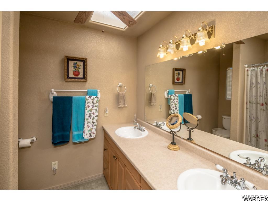14760 Powerline Road Kingman, AZ 86401 - Photo 6 of 36 a bathroom with a sink and a mirror