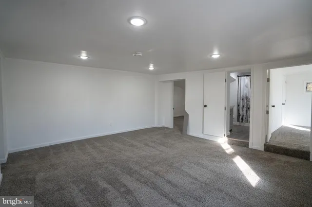 a view of a livingroom with a refrigerator