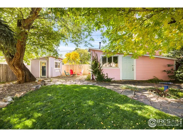 a backyard of a house with barbeque oven