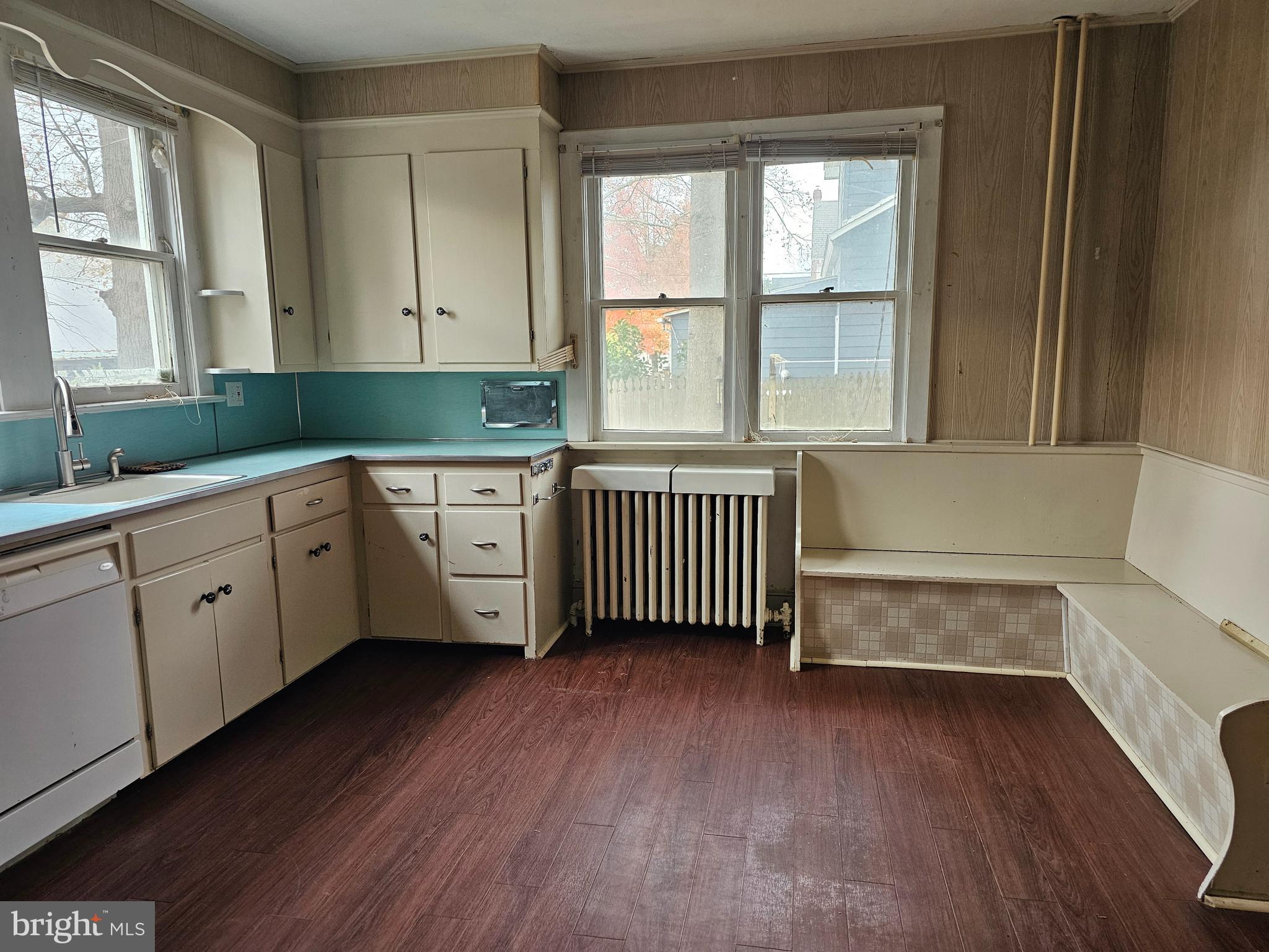 152 North Main Street Elmer, NJ 08318 - Photo 3 of 15 a hallway with a white cabinets and wooden floor