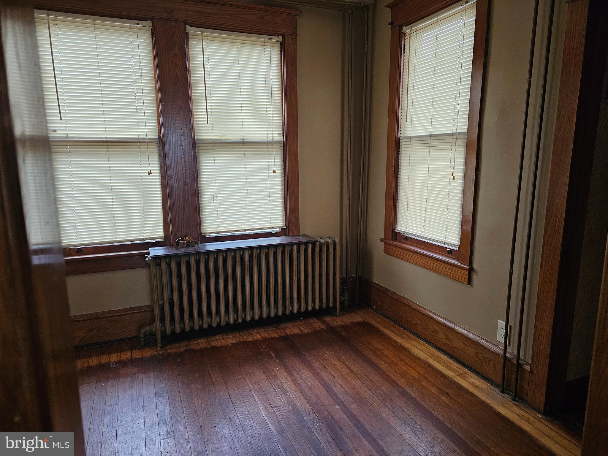 152 North Main Street Elmer, NJ 08318 - Photo 4 of 15 a view of a room with wooden floor and windows