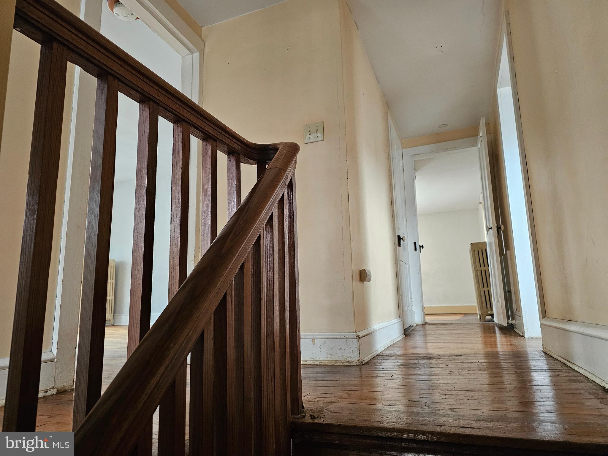 152 North Main Street Elmer, NJ 08318 - Photo 9 of 15 a view of an entryway with wooden floor and stairs