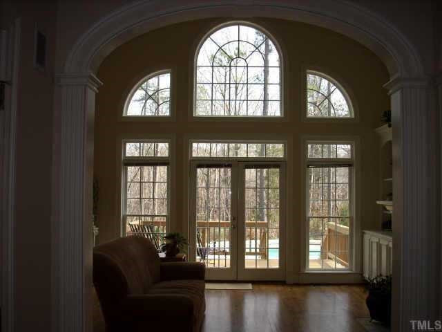 The dramatic family room windows provide fantastic views of the inground pool and beautifully landscaped backyard. Other