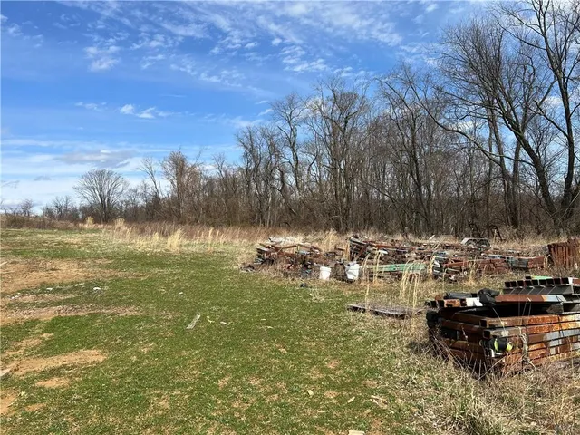 a view of a yard with an outdoor space
