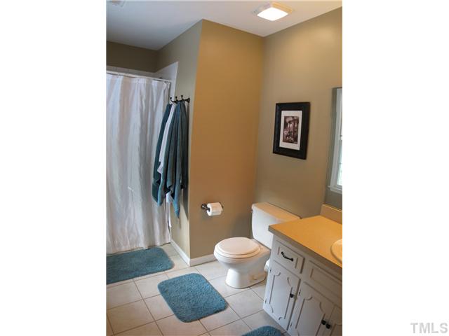 7536 Milestone Court Raleigh, NC 27615 - Photo 10 of 23 Master bath features ceramic tile floors and shower.
