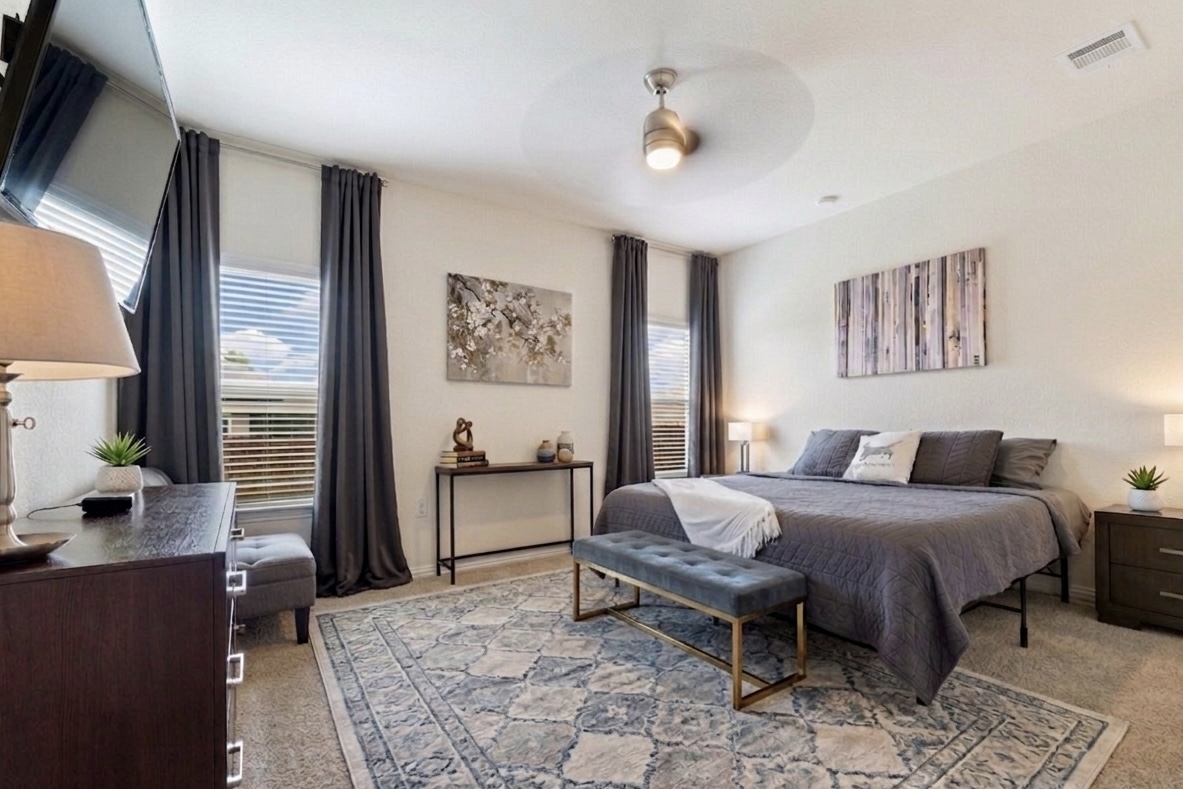 6905 Vail Ridge Street Austin, TX 78744 - Photo 12 of 39 Primary suite is downstairs. Photo is virtually staged.