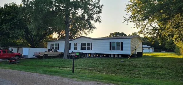 a view of a house with a back yard