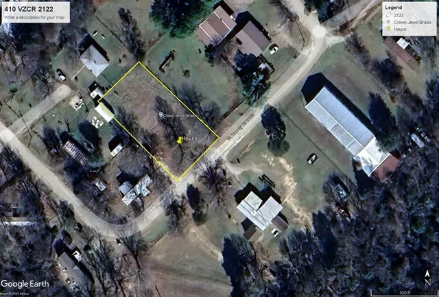 an aerial view of a house with outdoor space