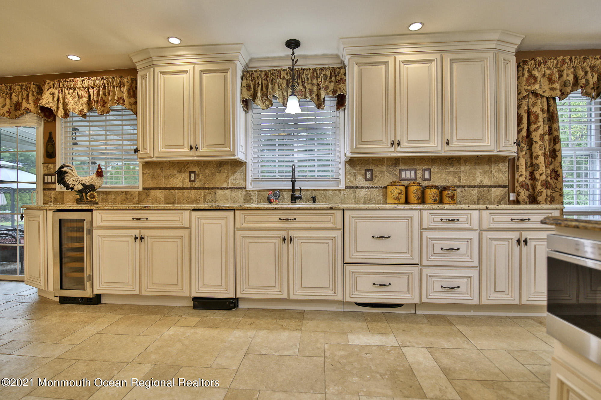 41 Merrick Road Farmingdale, NJ 07727 - Photo 14 of 48 a kitchen with stainless steel appliances granite countertop a sink and cabinets