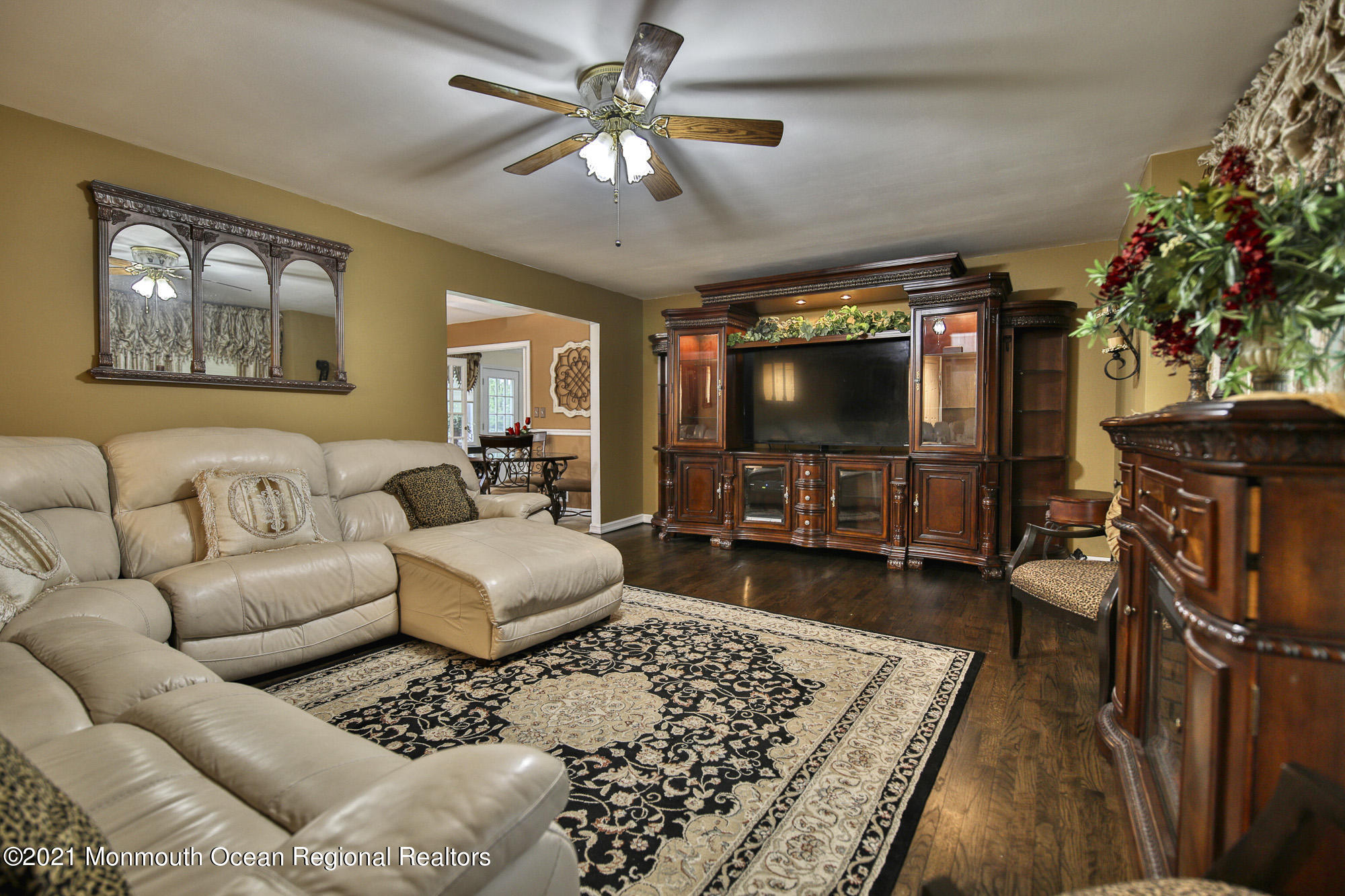 41 Merrick Road Farmingdale, NJ 07727 - Photo 22 of 48 a living room with furniture and a flat screen tv