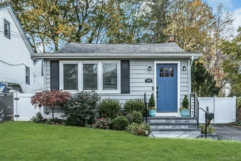 a front view of house with yard