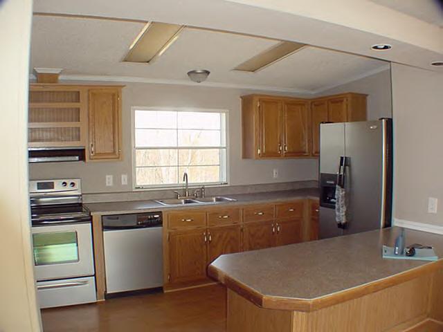 979 Hobson Road Axton, VA 24054 - Photo 2 of 10 a kitchen with stainless steel appliances granite countertop a sink stove and refrigerator