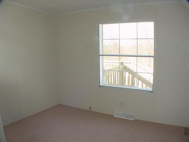 979 Hobson Road Axton, VA 24054 - Photo 6 of 10 an empty room with a window