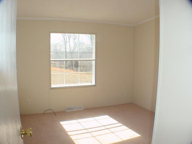 979 Hobson Road Axton, VA 24054 - Photo 7 of 10 an empty room with a window