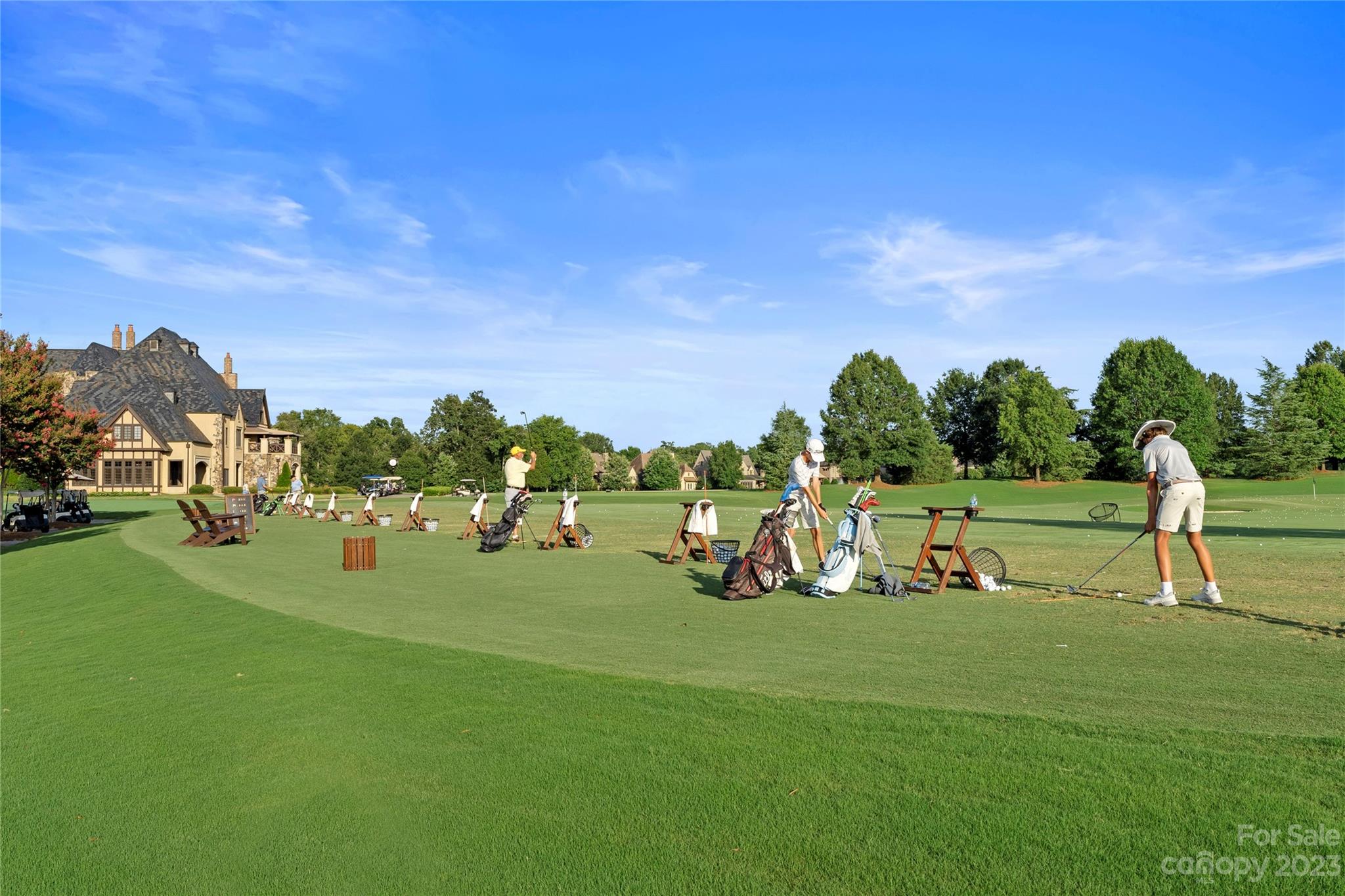 a view of a golf course with chairs