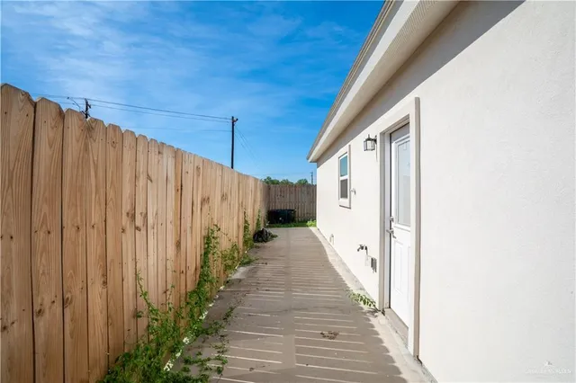 a view of a pathway of a house with wooden floor