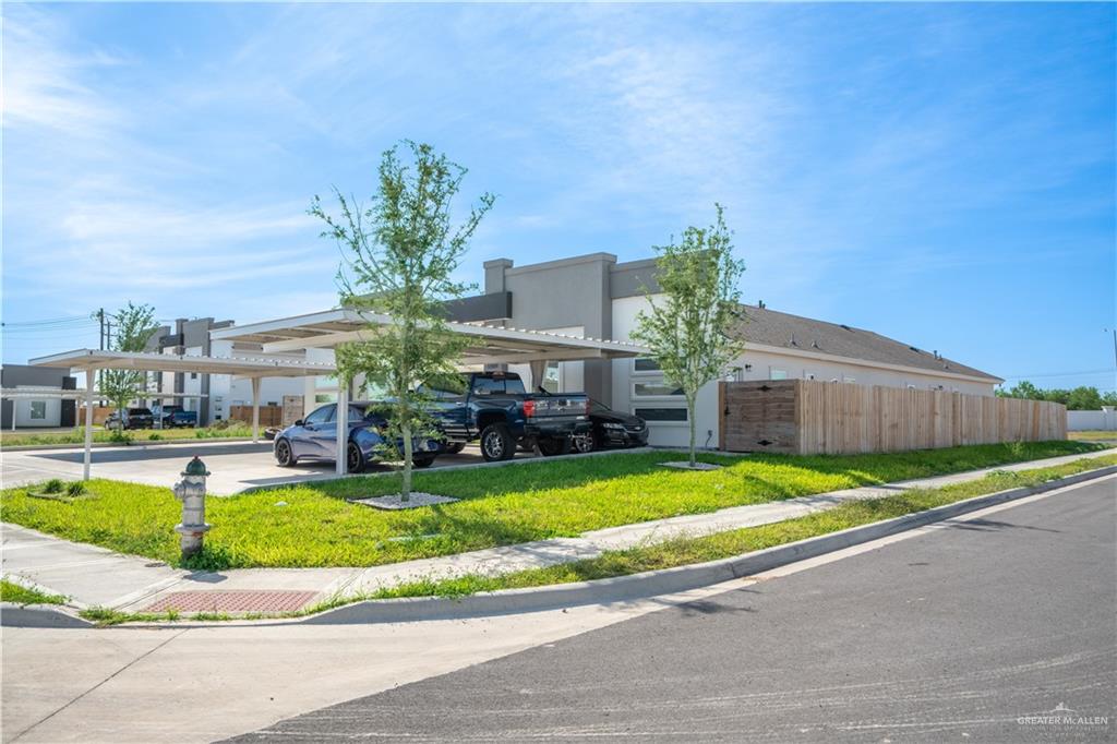 12509 North 40th Street, Unit 4 Edinburg, TX 78541 - Photo 2 of 27 a view of a house with a swimming pool and a yard