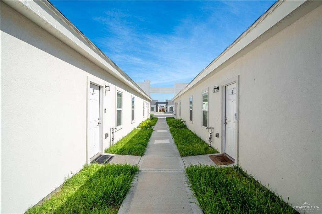 12509 North 40th Street, Unit 4 Edinburg, TX 78541 - Photo 25 of 27 a view of a pathway with house on both side