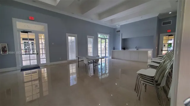 a lobby with furniture and rug