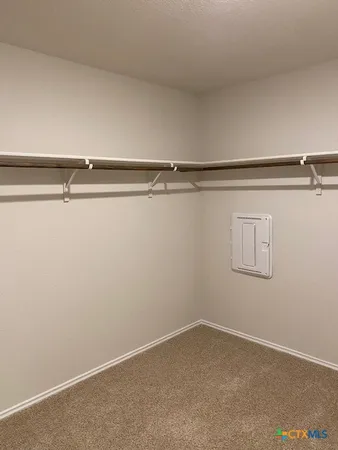 a white toilet sitting in a bathroom