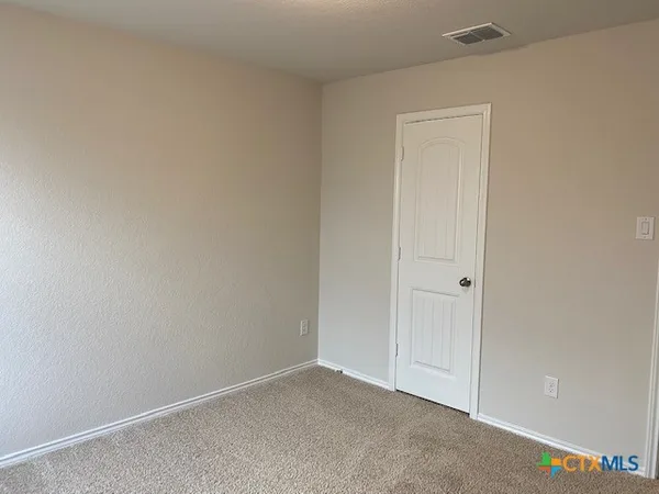 a kitchen with granite countertop a stove and a sink