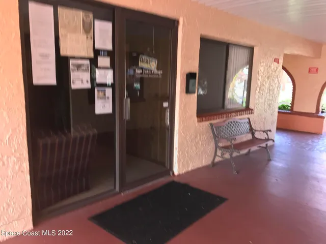 a view of a house with a yard and a lake view
