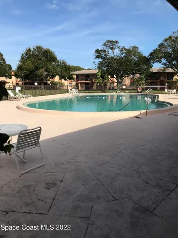a view of a lake with a house in the background