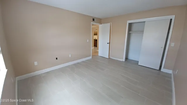 a view of a livingroom with furniture and staircase
