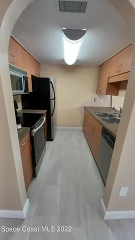 a kitchen with stainless steel appliances granite countertop a stove and a sink