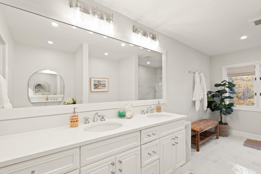 300 Willow Street, Unit 3 Hamilton, MA 01982 - Photo 19 of 39 a bathroom with a sink double vanity and a mirror