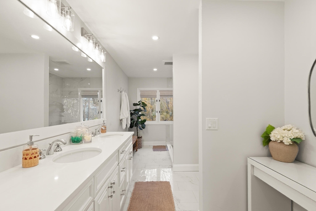 300 Willow Street, Unit 3 Hamilton, MA 01982 - Photo 20 of 39 a bathroom with a sink double vanity and a mirror